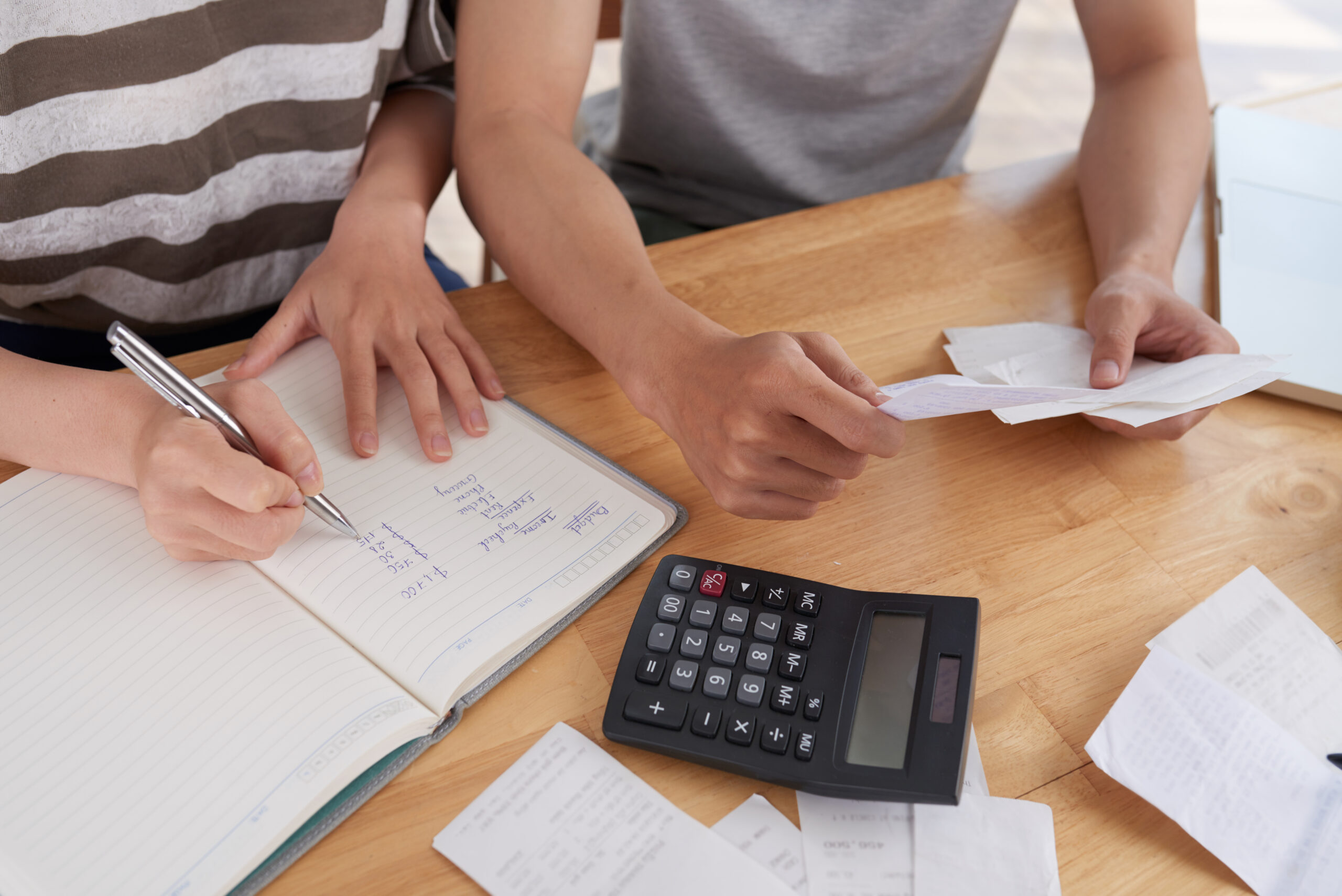 two persons computing for expenses