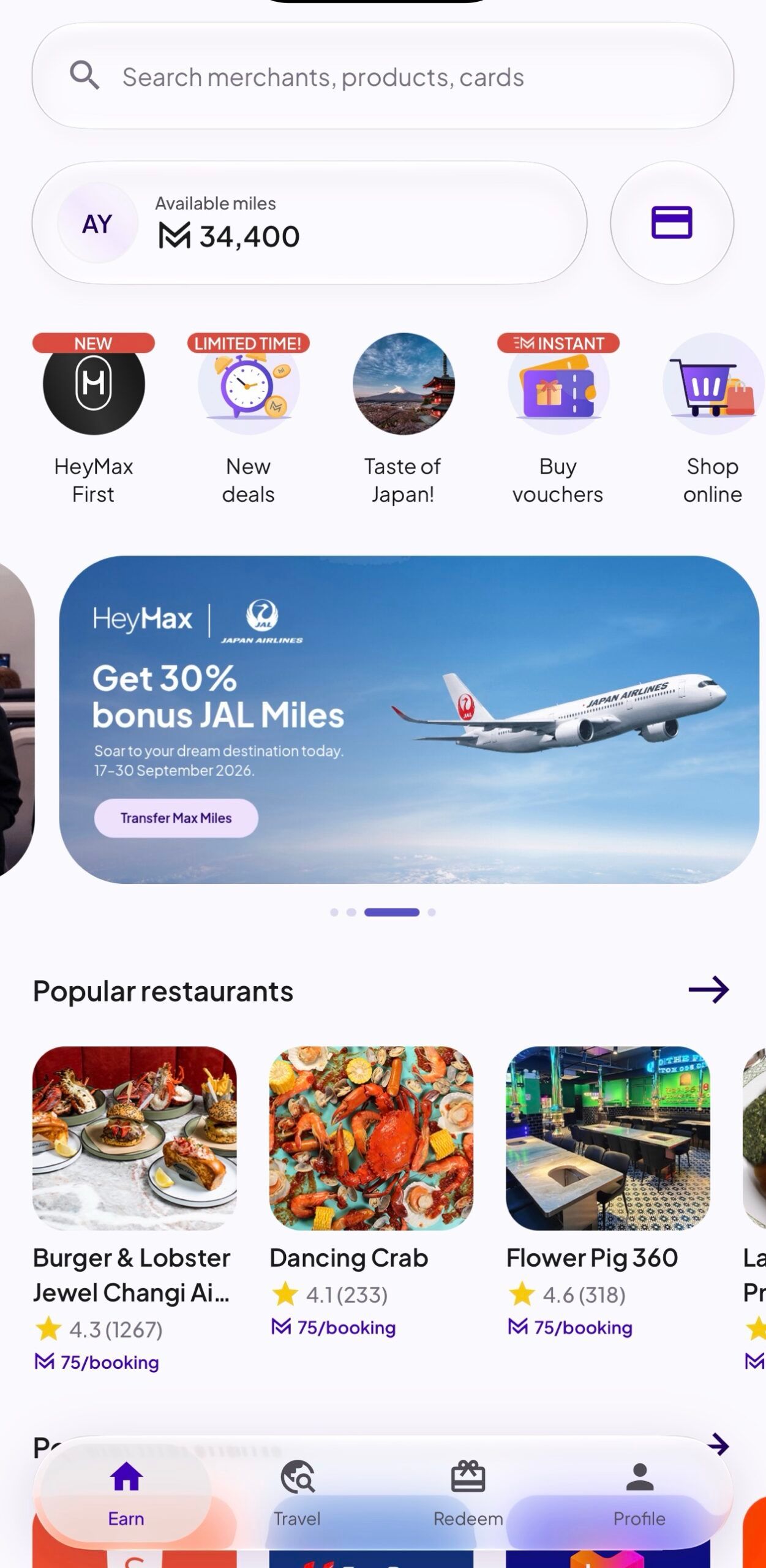 HeyMax app home screen with the Available miles balance at the top and the Earn, Travel, Redeem and Profile tabs at the bottom