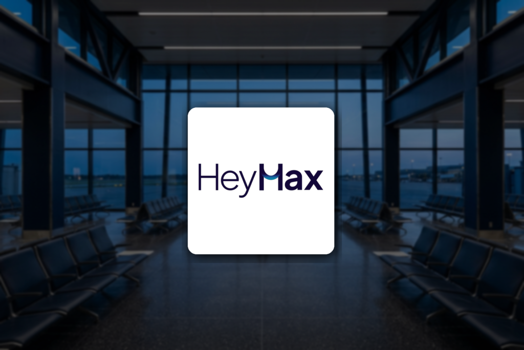 HeyMax logo over an airport departure hall, for a guide to redeeming Max Miles in Singapore