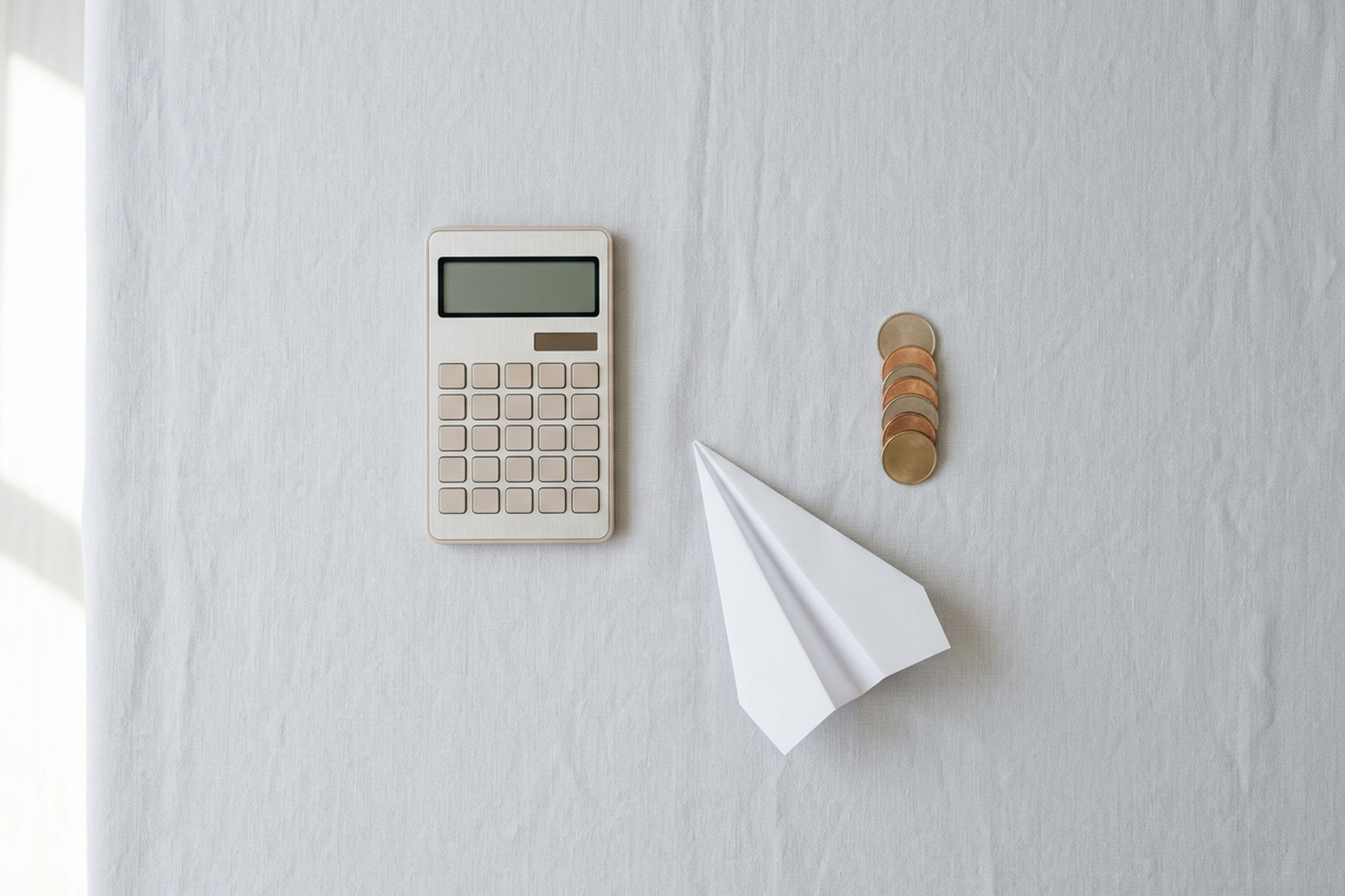 Calculator, coins and a paper plane — deciding whether CardUp/iPayMy service fees are worth paying for miles